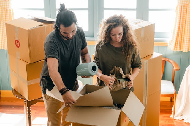 People packing things into boxes